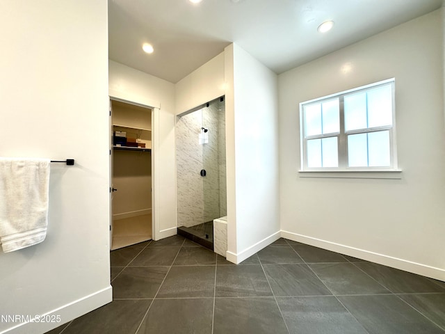 5454 Side Saddle Trl, Reno, NV 89511 - full bathroom featuring a stall shower, a walk in closet, tile patterned flooring, and recessed lighting