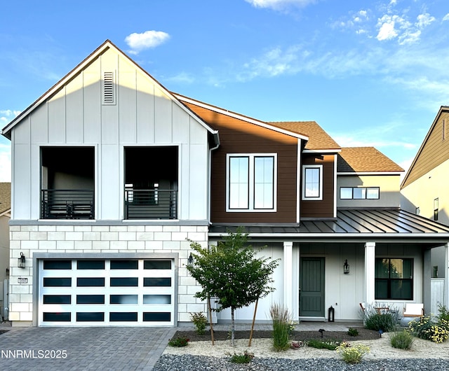 5454 Side Saddle Trl, Reno, NV 89511 - view of front facade with a standing seam roof, a porch, board and batten siding, and a metal roof