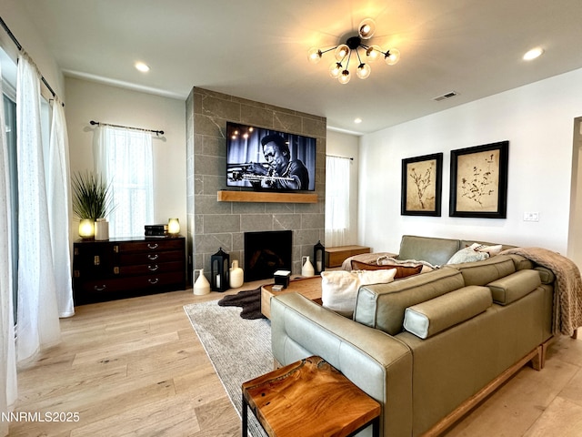 5454 Side Saddle Trl, Reno, NV 89511 - living room with a fireplace, wood finished floors, and recessed lighting