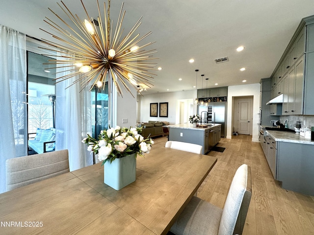 5454 Side Saddle Trl, Reno, NV 89511 - dining space with a chandelier, light wood-type flooring, and recessed lighting