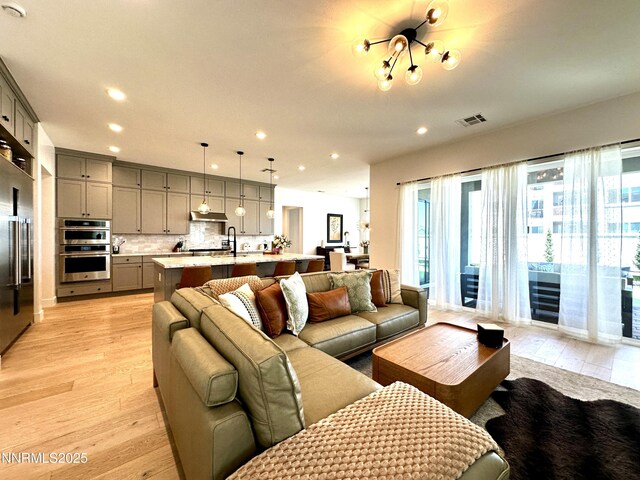5454 Side Saddle Trl, Reno, NV 89511 - living area with light wood-style flooring, plenty of natural light, and recessed lighting
