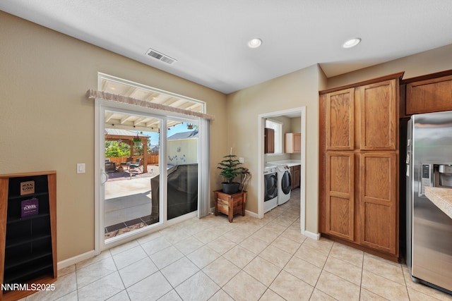 164 Oakridge Dr, Dayton, NV 89403 - doorway featuring washer and dryer, light tile patterned floors, and recessed lighting
