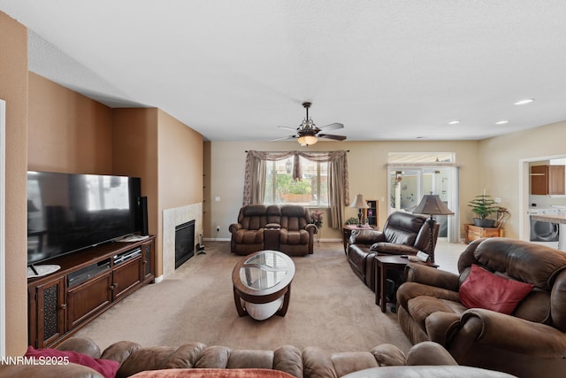 164 Oakridge Dr, Dayton, NV 89403 - living room with light colored carpet, a high end fireplace, a ceiling fan, washer / clothes dryer, and recessed lighting