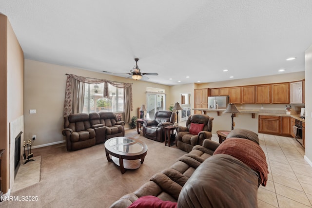 164 Oakridge Dr, Dayton, NV 89403 - living area featuring a ceiling fan, recessed lighting, a fireplace, and light carpet