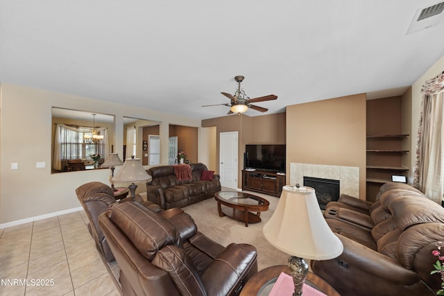 164 Oakridge Dr, Dayton, NV 89403 - living area with a chandelier, ceiling fan, a fireplace, and light tile patterned floors