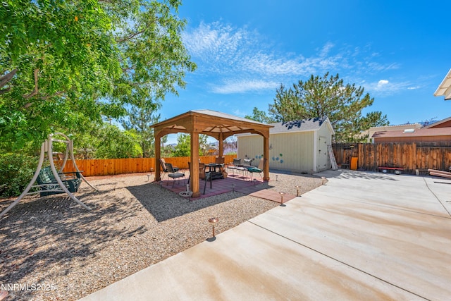 164 Oakridge Dr, Dayton, NV 89403 - fenced backyard featuring a gazebo, a patio, and a storage unit