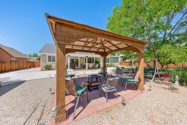 164 Oakridge Dr, Dayton, NV 89403 - fenced backyard with a gazebo, an outdoor fire pit, and a patio