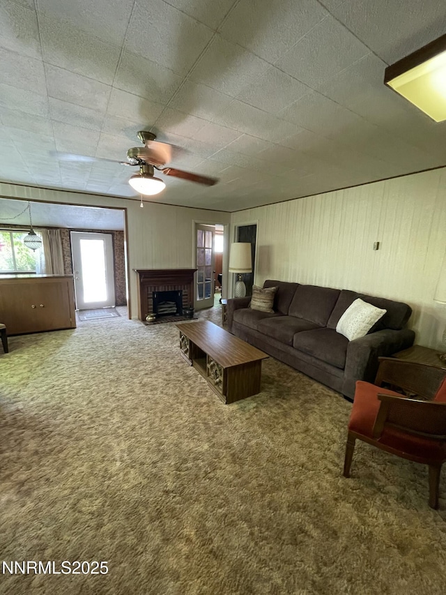 4 3rd St, Mcgill, NV 89318 - carpeted living room with ceiling fan and a brick fireplace