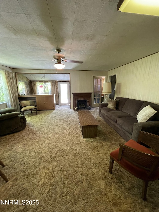 4 3rd St, Mcgill, NV 89318 - living area featuring a brick fireplace, carpet floors, healthy amount of natural light, and ceiling fan
