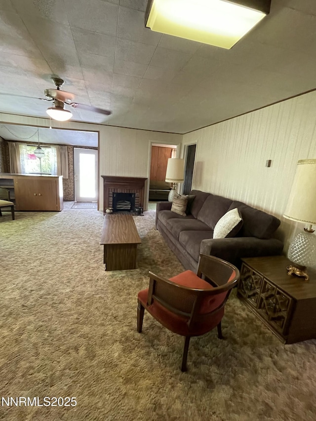 4 3rd St, Mcgill, NV 89318 - living room featuring carpet, a fireplace, and a ceiling fan
