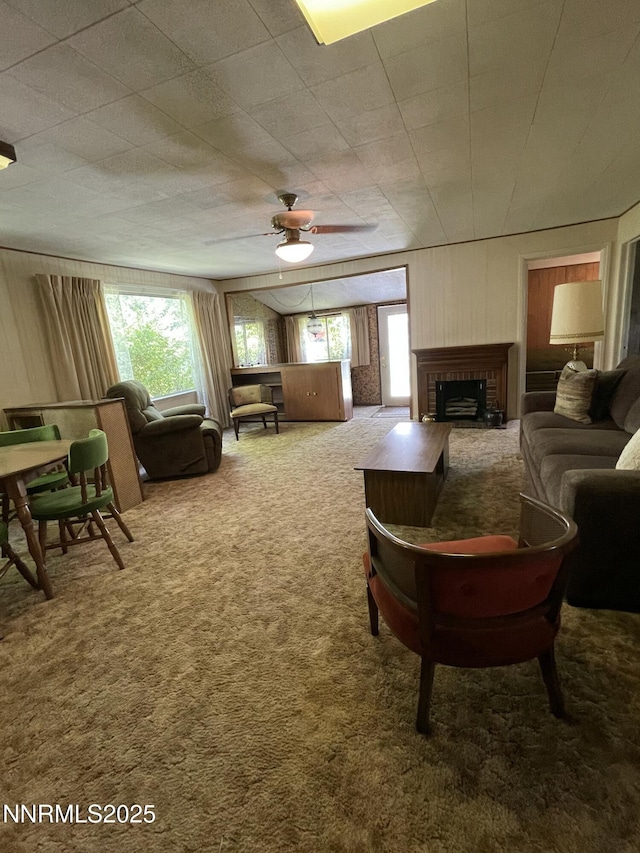 4 3rd St, Mcgill, NV 89318 - carpeted living room featuring a fireplace and ceiling fan