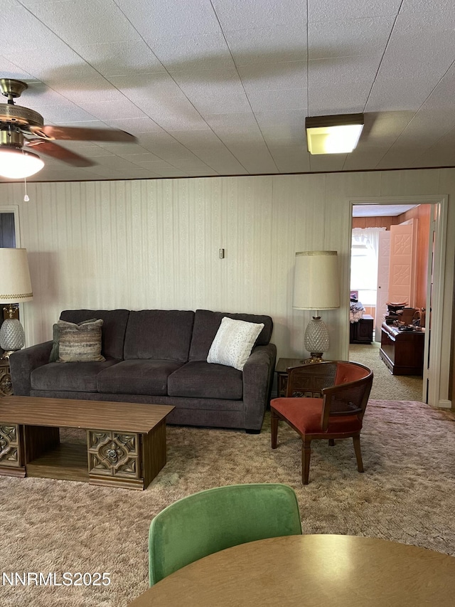 4 3rd St, Mcgill, NV 89318 - living room featuring carpet floors, ceiling fan, and wooden walls