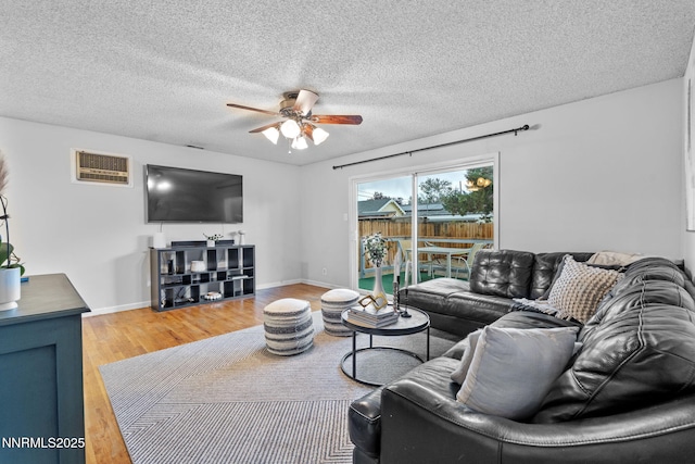 3200 Vickie Ln, Sparks, NV 89431 - living room with ceiling fan, light wood-style floors, and a textured ceiling