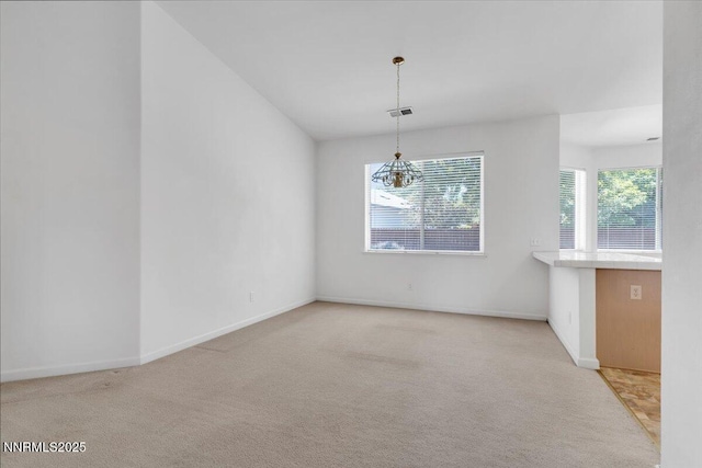 1797 Lantana Dr, Minden, NV 89423 - unfurnished dining area with light carpet and a chandelier