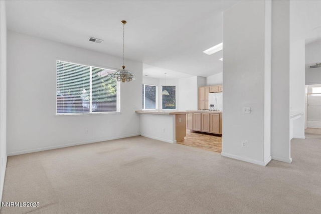 1797 Lantana Dr, Minden, NV 89423 - unfurnished living room featuring light carpet, a chandelier, and a skylight