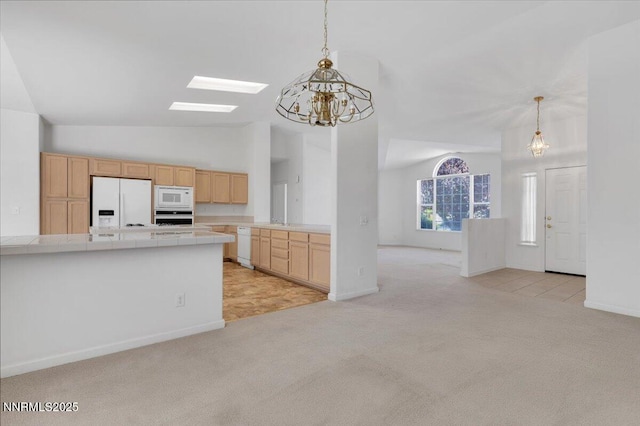 1797 Lantana Dr, Minden, NV 89423 - kitchen featuring white appliances, light colored carpet, a chandelier, tile countertops, and lofted ceiling