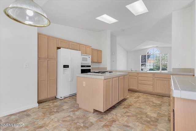 1797 Lantana Dr, Minden, NV 89423 - kitchen with white appliances, light brown cabinets, tile countertops, stone finish flooring, and lofted ceiling