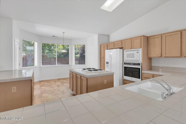 1797 Lantana Dr, Minden, NV 89423 - kitchen with white appliances, a kitchen island, tile counters, pendant lighting, and lofted ceiling