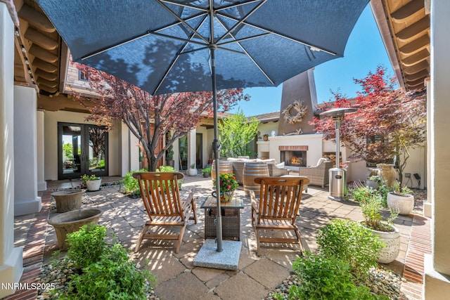 186 Carleton Ct, Reno, NV 89511 - view of patio / terrace featuring a warm lit fireplace