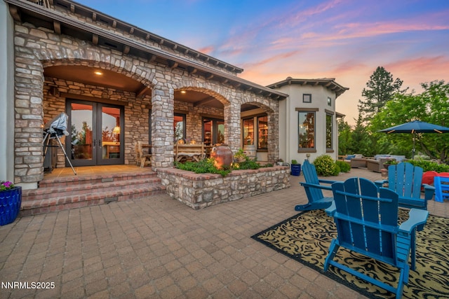 186 Carleton Ct, Reno, NV 89511 - patio terrace at dusk with french doors and a patio area