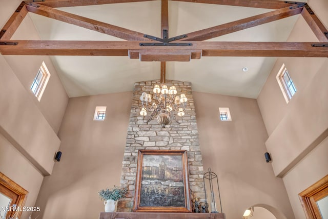 186 Carleton Ct, Reno, NV 89511 - unfurnished living room featuring high vaulted ceiling, beamed ceiling, and a chandelier