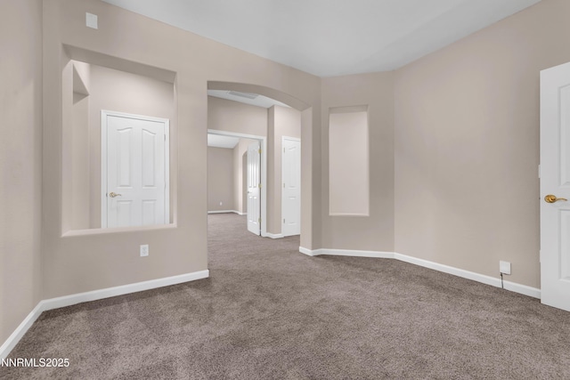 5287 Vidette Meadows Dr, Sparks, NV 89436 - carpeted spare room featuring arched walkways and baseboards