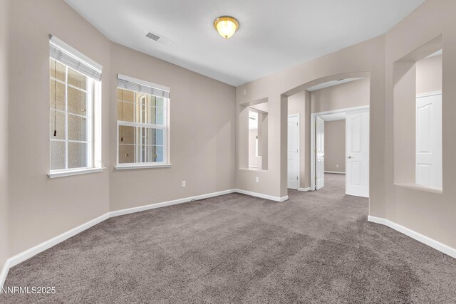5287 Vidette Meadows Dr, Sparks, NV 89436 - unfurnished room featuring carpet floors and arched walkways