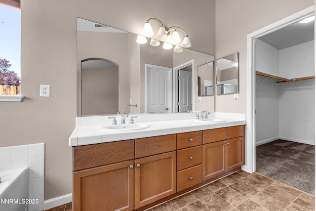 5287 Vidette Meadows Dr, Sparks, NV 89436 - full bath featuring double vanity, a tub, a spacious closet, and a textured wall