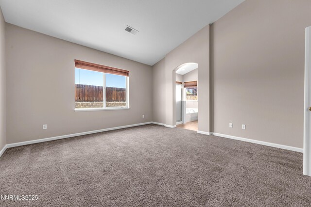 5287 Vidette Meadows Dr, Sparks, NV 89436 - carpeted empty room with arched walkways and lofted ceiling