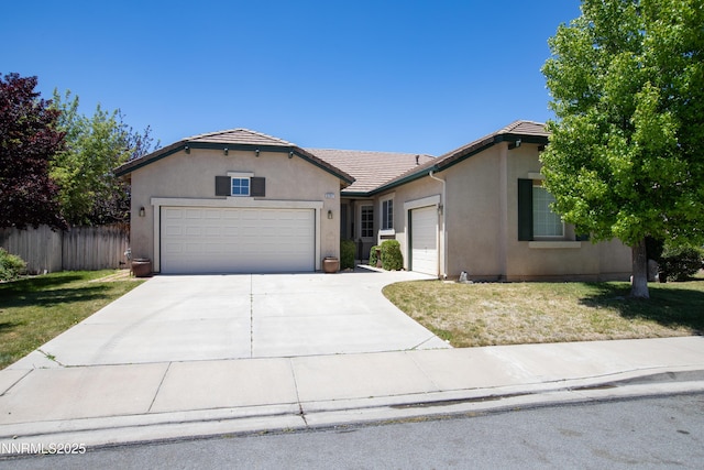 5287 Vidette Meadows Dr, Sparks, NV 89436 - ranch-style home with a garage, a tile roof, stucco siding, and driveway