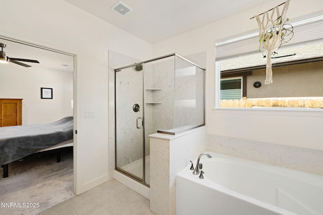1149 Dapple Dr, Minden, NV 89423 - ensuite bathroom with a garden tub, a stall shower, tile patterned flooring, and a ceiling fan