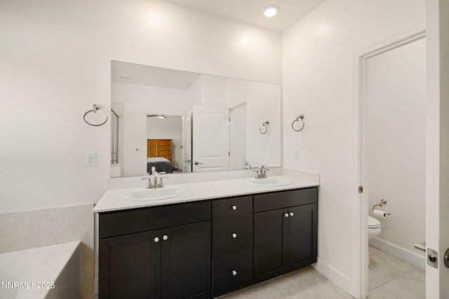 1149 Dapple Dr, Minden, NV 89423 - ensuite bathroom with double vanity, tile patterned flooring, and a garden tub