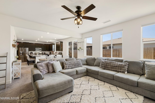 1149 Dapple Dr, Minden, NV 89423 - living area with a ceiling fan, recessed lighting, and light carpet