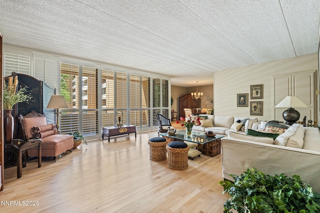 1200 Riverside Dr # 1232, Reno, NV 89503 - living area featuring a chandelier, wood finished floors, and a textured ceiling