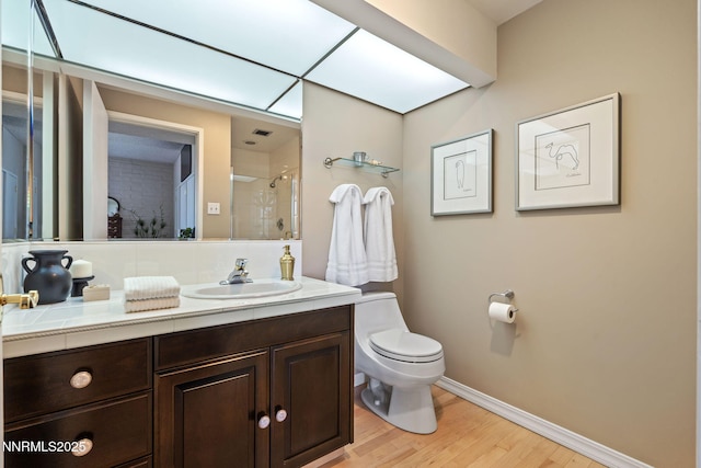 1200 Riverside Dr # 1232, Reno, NV 89503 - bathroom with wood finished floors, an enclosed shower, and vanity