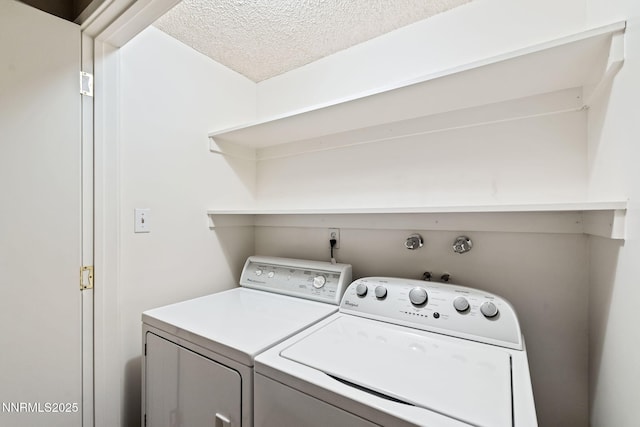 1200 Riverside Dr # 1232, Reno, NV 89503 - washroom featuring washing machine and dryer and a textured ceiling