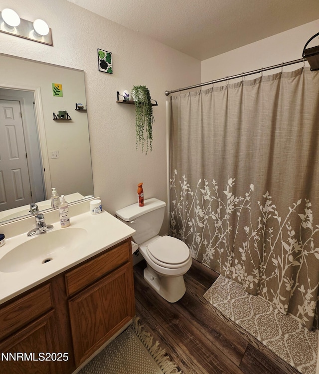 5776 Sculptor Ct, Sun Valley, NV 89433 - full bath featuring wood finished floors, vanity, and a shower with curtain