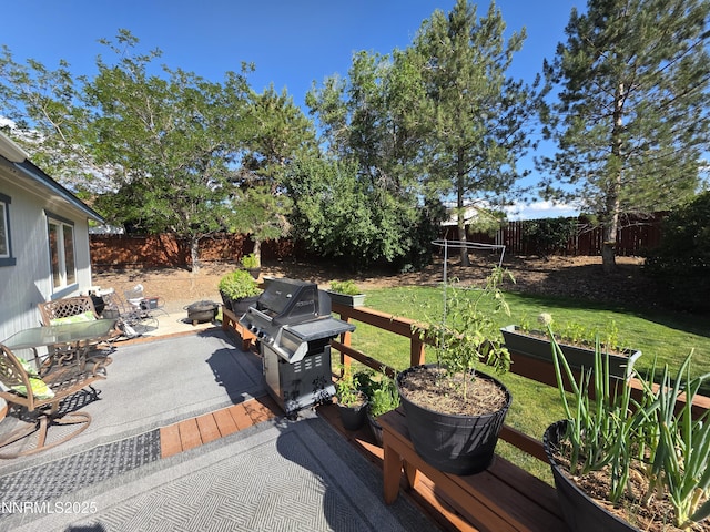 5776 Sculptor Ct, Sun Valley, NV 89433 - wooden deck featuring a fenced backyard, grilling area, and a patio