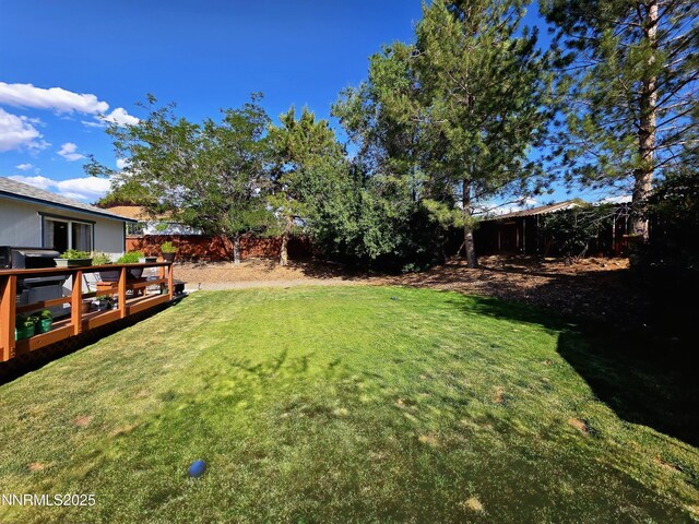5776 Sculptor Ct, Sun Valley, NV 89433 - fenced backyard featuring a deck