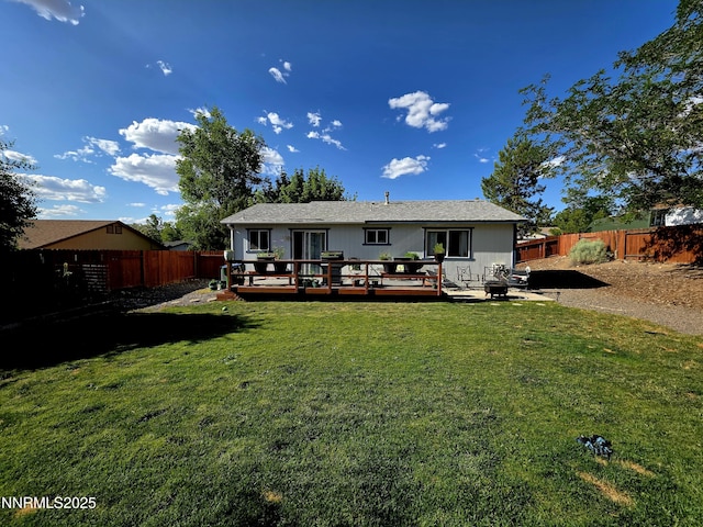 5776 Sculptor Ct, Sun Valley, NV 89433 - back of property featuring a fenced backyard and a wooden deck