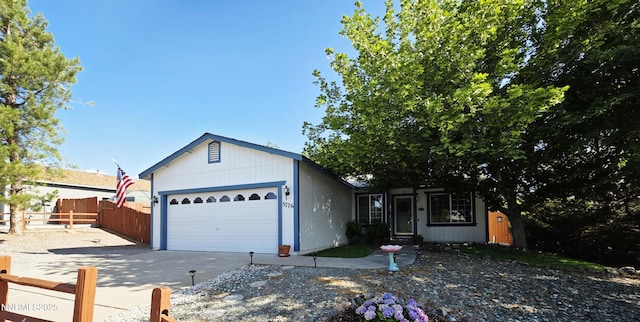 5776 Sculptor Ct, Sun Valley, NV 89433 - view of front of house featuring a garage and concrete driveway