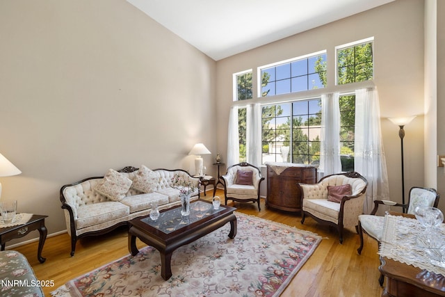 3280 Thornhill Dr, Reno, NV 89509 - living room with high vaulted ceiling and light wood-style flooring