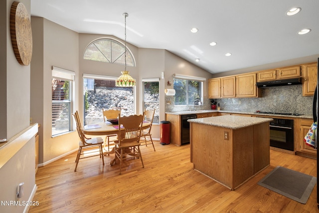 3280 Thornhill Dr, Reno, NV 89509 - kitchen with under cabinet range hood, black appliances, lofted ceiling, tasteful backsplash, and recessed lighting