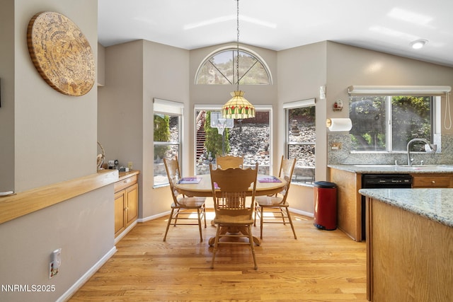 3280 Thornhill Dr, Reno, NV 89509 - dining space featuring light wood finished floors and lofted ceiling