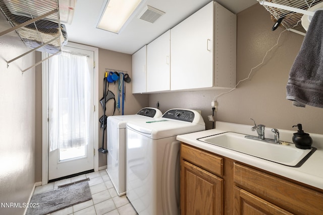 3280 Thornhill Dr, Reno, NV 89509 - laundry area with independent washer and dryer, cabinet space, and light tile patterned floors