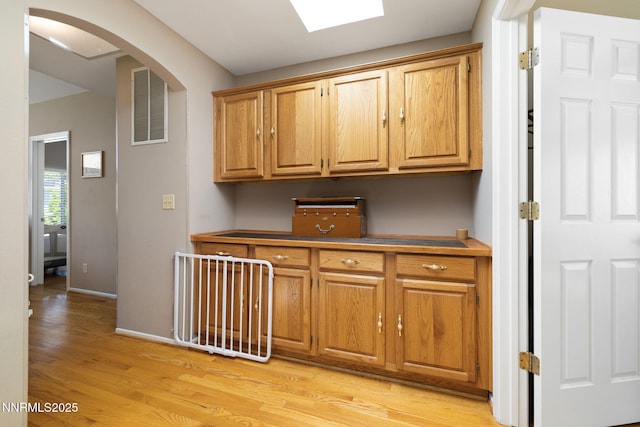 3280 Thornhill Dr, Reno, NV 89509 - bar featuring light wood-type flooring and arched walkways