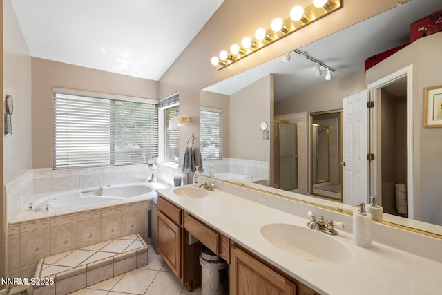3280 Thornhill Dr, Reno, NV 89509 - bathroom featuring a garden tub, a stall shower, tile patterned flooring, double vanity, and lofted ceiling