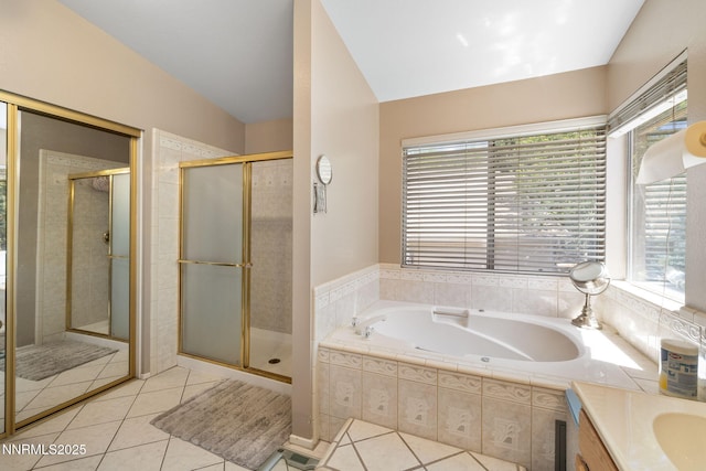 3280 Thornhill Dr, Reno, NV 89509 - bathroom featuring tile patterned flooring, a bath, a shower stall, vanity, and vaulted ceiling