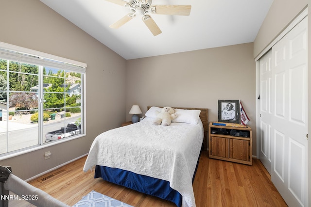 3280 Thornhill Dr, Reno, NV 89509 - bedroom with vaulted ceiling, wood finished floors, a closet, and a ceiling fan
