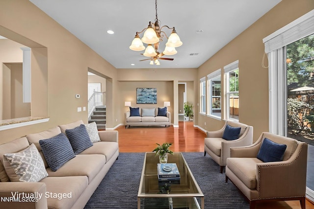 2125 Heavenly View Trl, Reno, NV 89523 - living area with a chandelier, wood finished floors, recessed lighting, and stairs